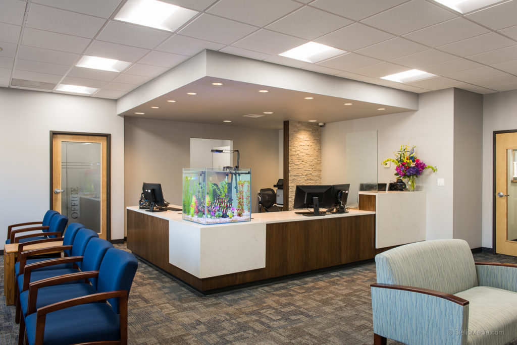 Office with florescent lighting and recessed lighting