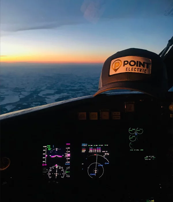 electrical contracting company point electric hat in airplace cockpit