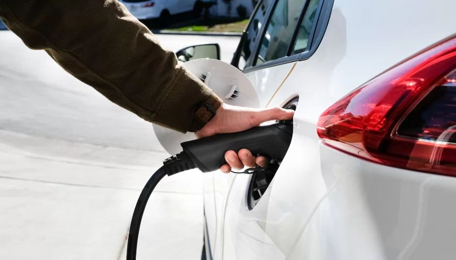 One of the levels of EV chargers, a level 2 charger being used on an automobile.