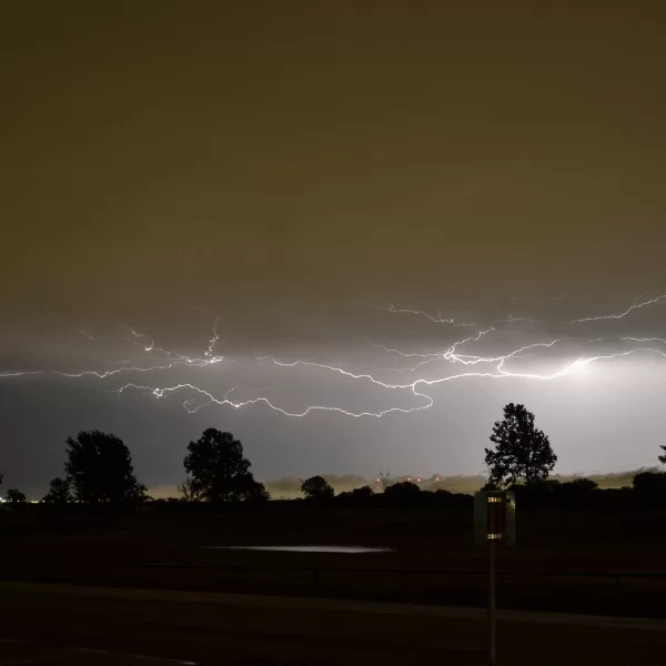 This image shows a storm with lighting, the type that may cause spring storm electrical damage to your home or business.