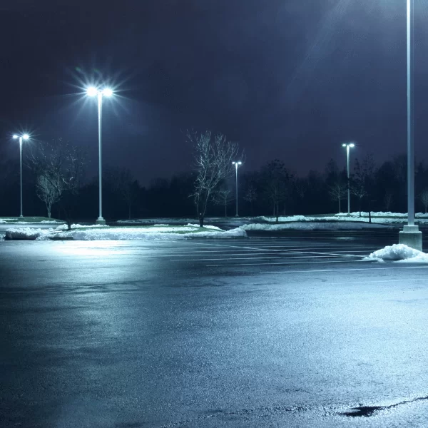 Image of a parking lot with exterior lighting installation, making it safer and more secure during the darker days of winter.